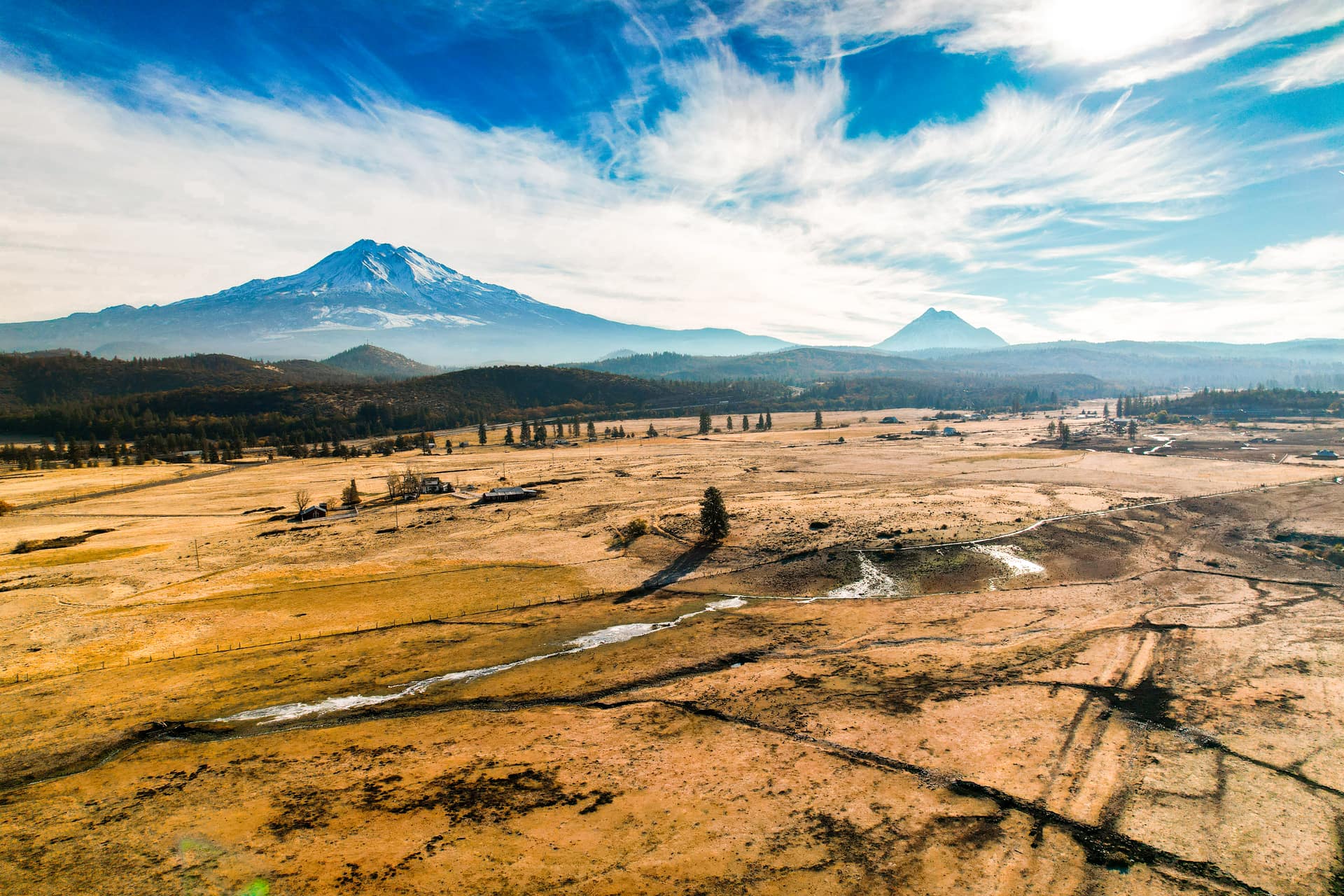 Aerial view of Mount Shasta rising over the Siskiyou County valley